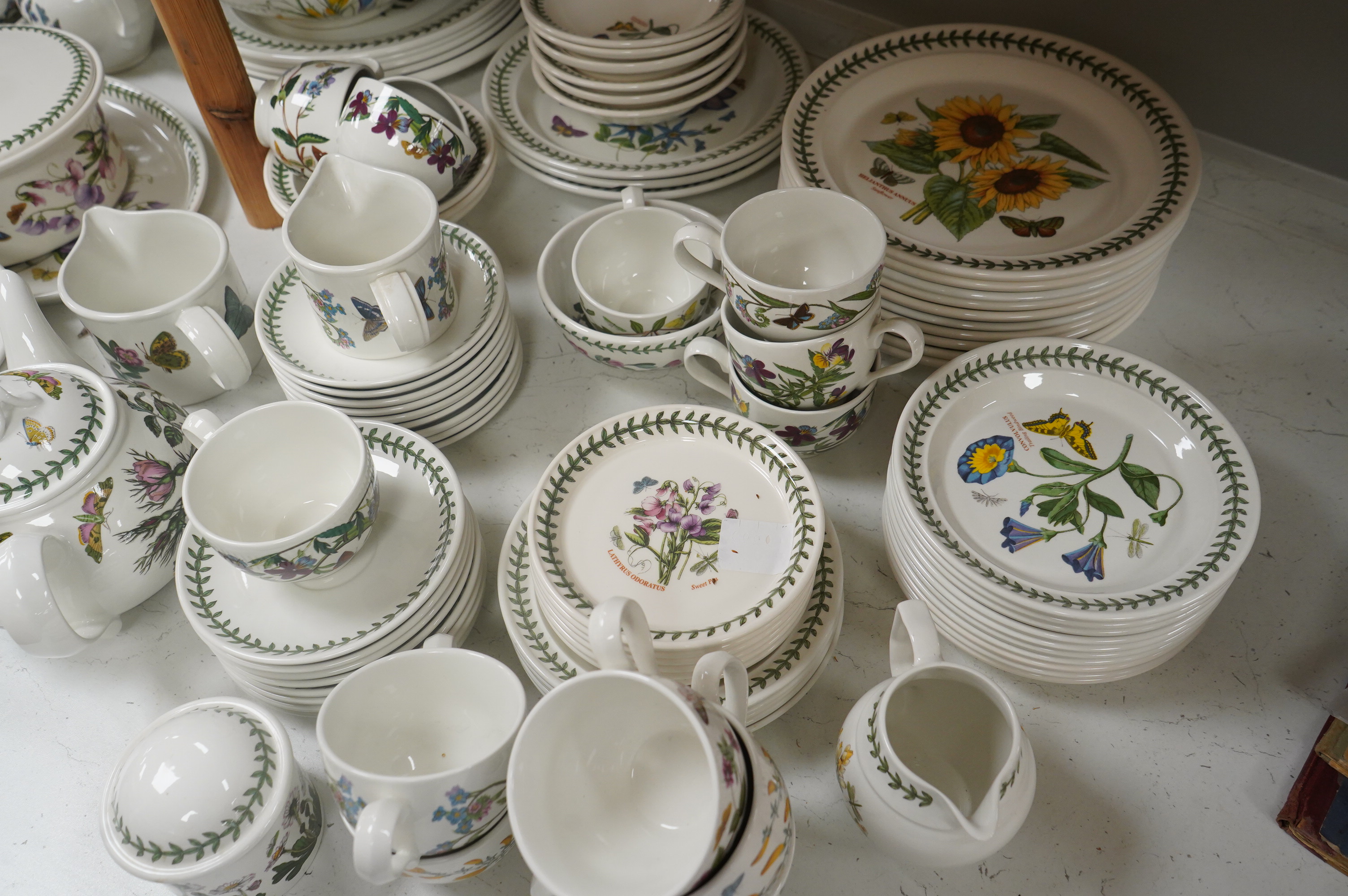 A large quantity of Portmerion Botanic Garden dinner and tea wares to include graduated bowls, dinner plates and side plates